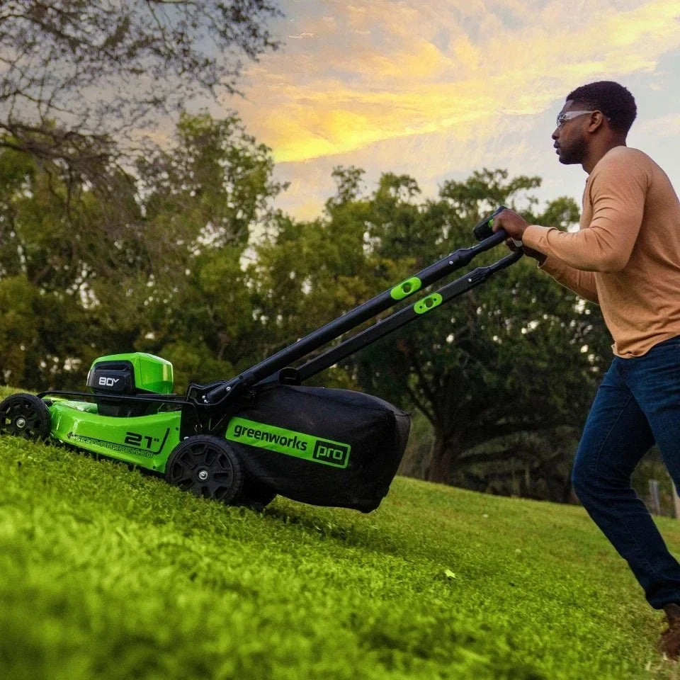Greenworks 80V 21” Lawn Mower, 13” String Trimmer, and 730 Leaf Blowers.